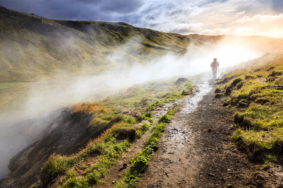 Hiker doing the hot springs hike in Reykjadalur Valley