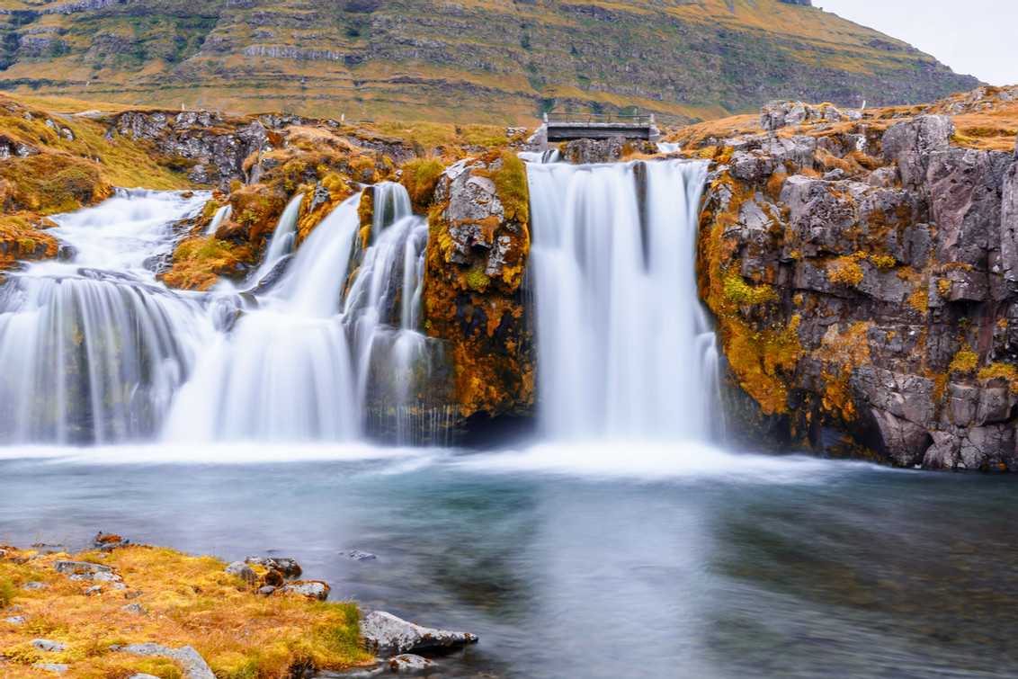 Driving in Iceland in the fall foliage and waterfall