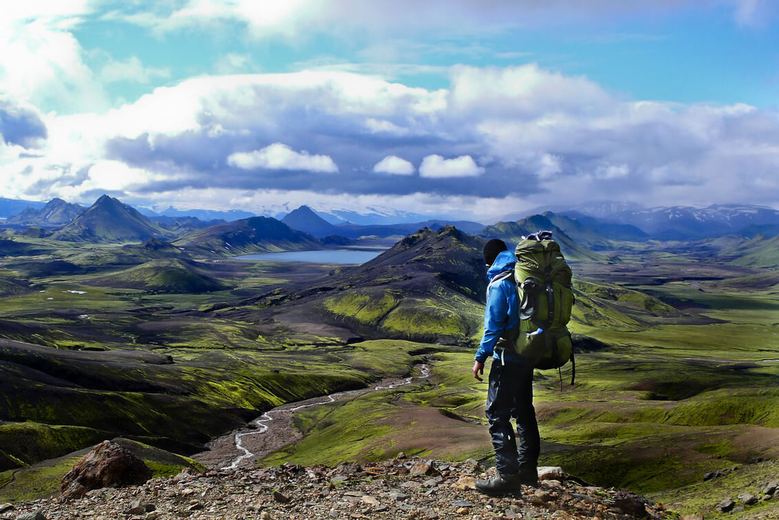 Iceland traveler with essentials packed in his backpack