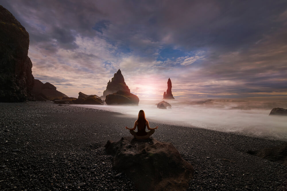 Women practicing Yoga in a relaxing place in Iceland