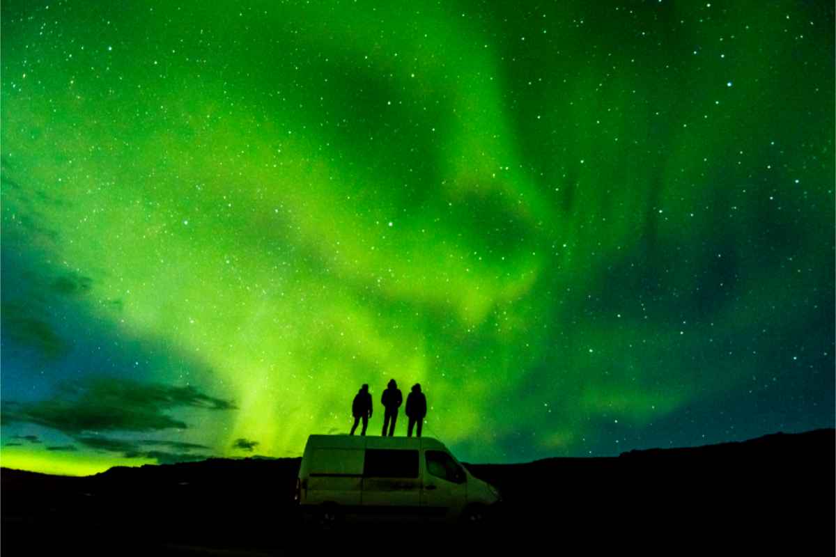 Tourist viewing the northern Lights from their camper