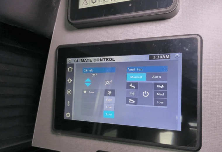 Smart RV climate control system with a touchscreen panel, allowing temperature and ventilation adjustments via WiFi and mobile app.