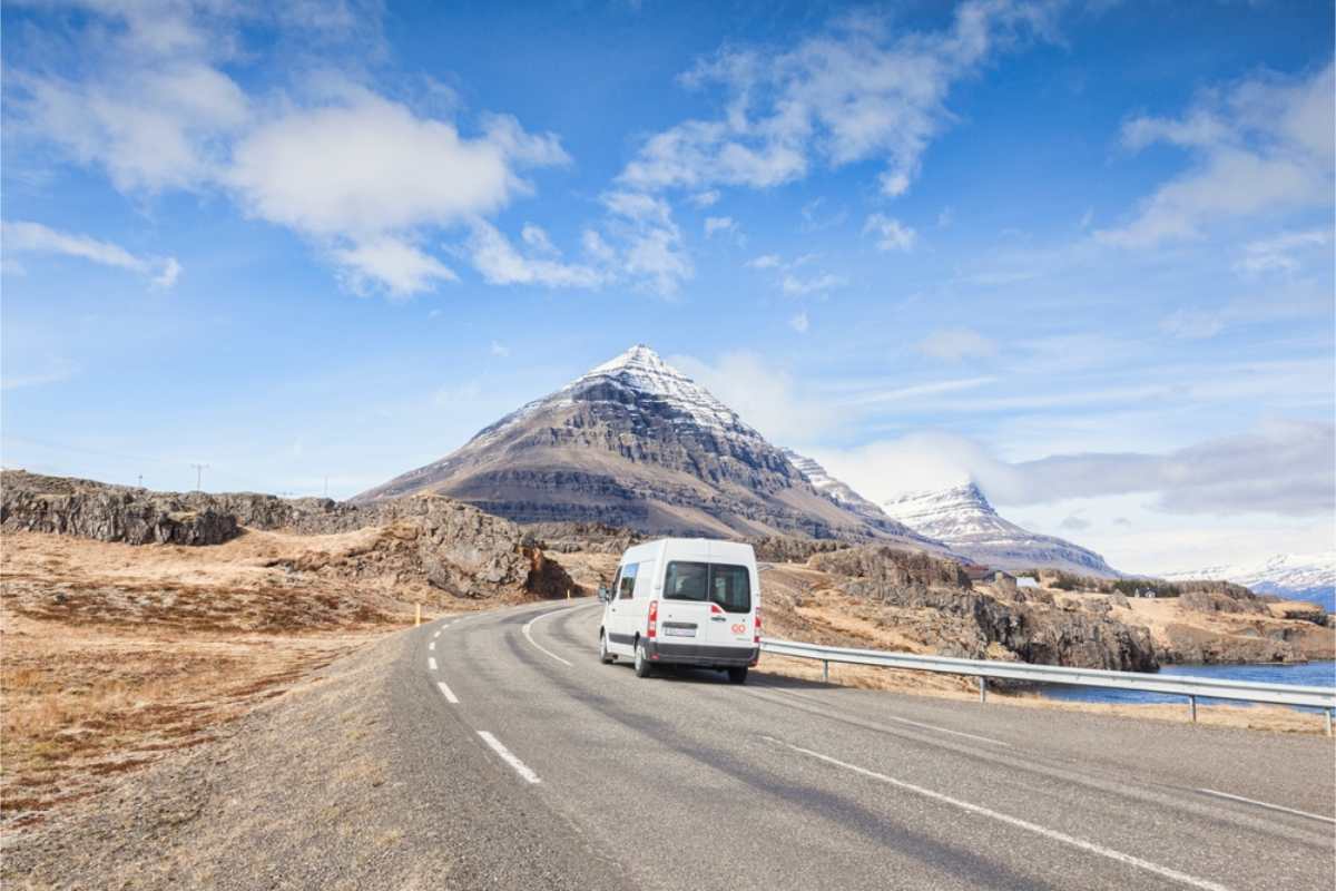 camper rolling through a road in Iceland