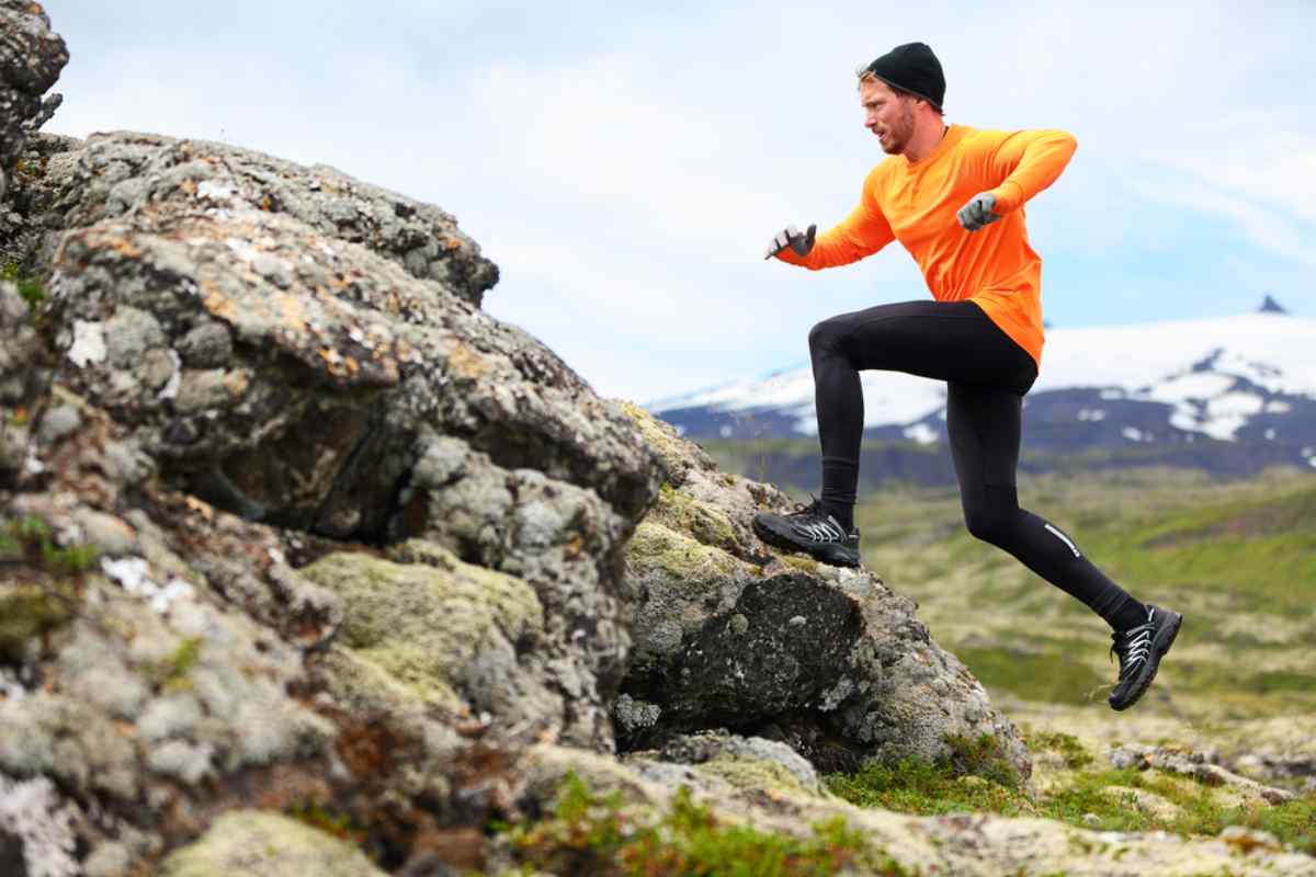 Hiker running up a hill in Iceland