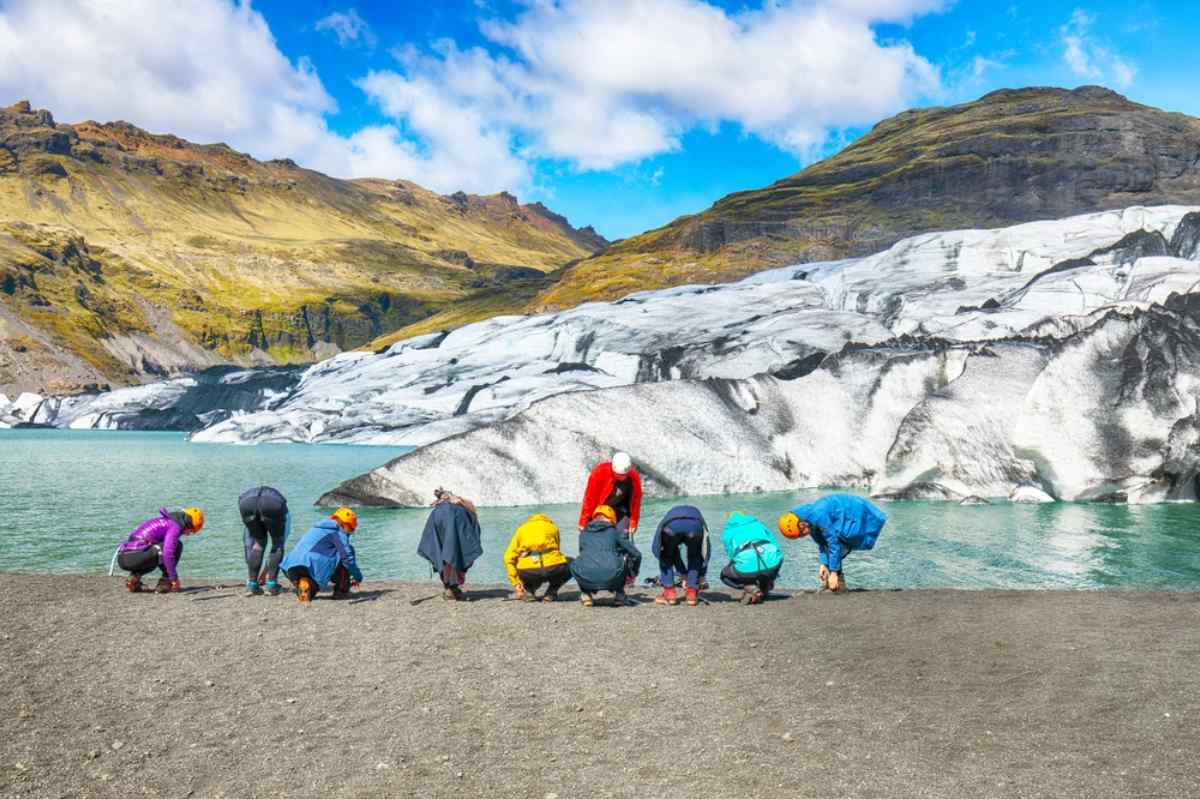 Group of tourist getting their equipment ready to hike a glacier