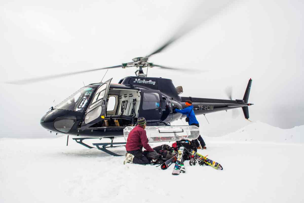 Helicopter on snow getting set up for heliskiing