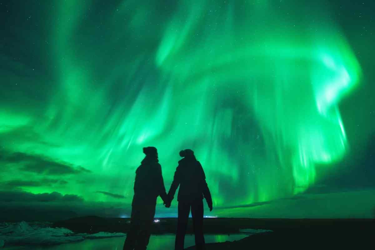 Couple enjoying the Northern Lights