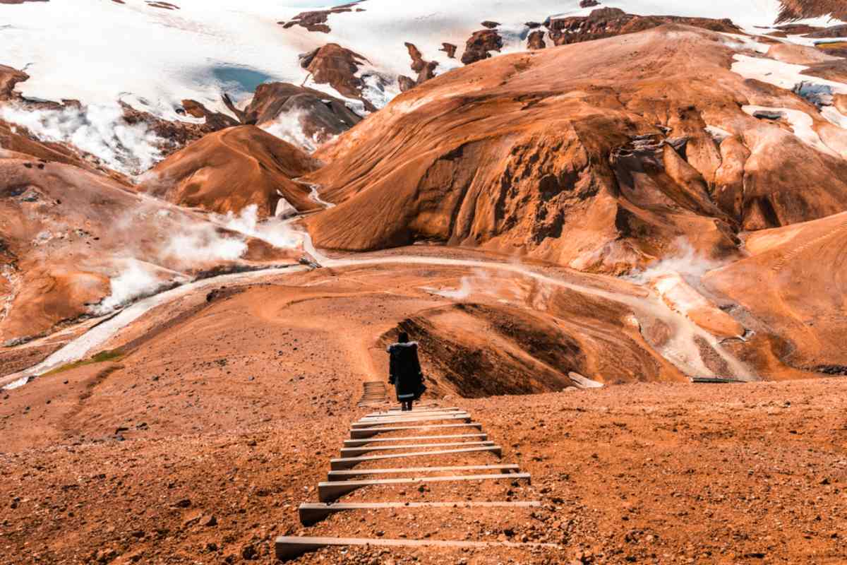 Tourist comming down the stairs at Maenir peak