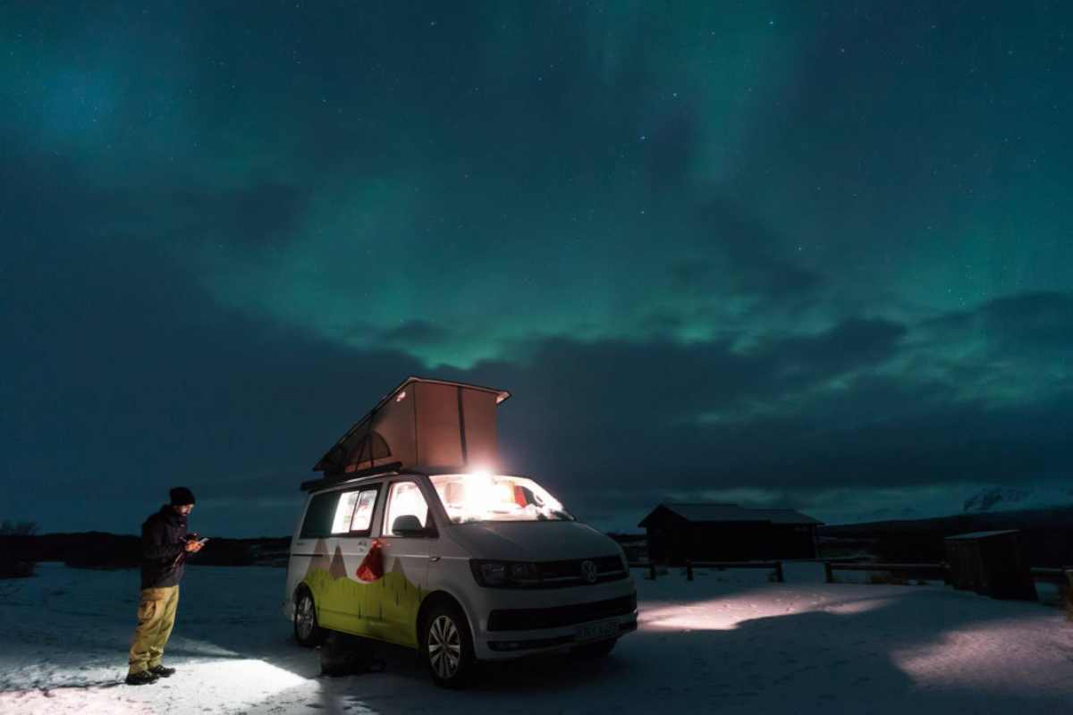 Tourist with a California Beach 4x4 during the winter time with the aurora