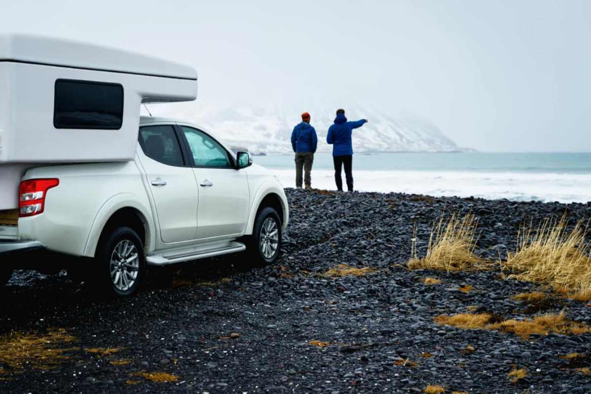 Campervan Hilux 4x4 in front of a snowed landscape in winter in Iceland