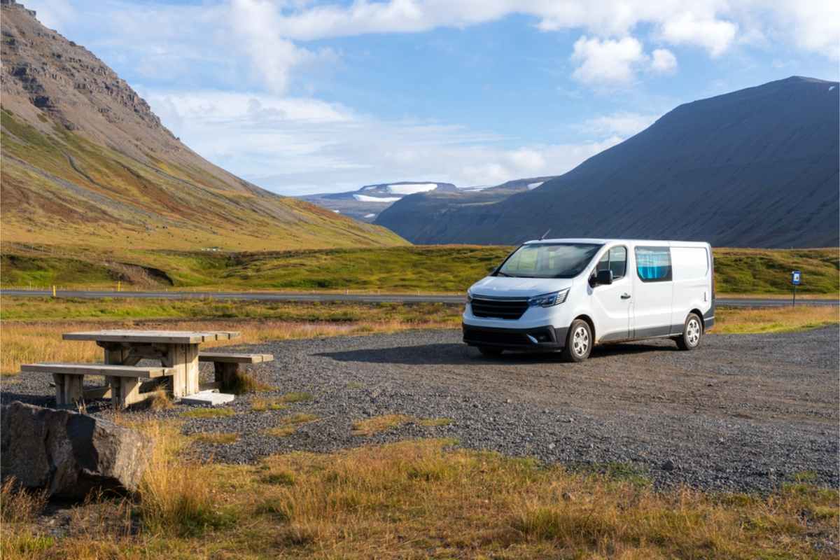 White campervan parked by a picnic area in Iceland