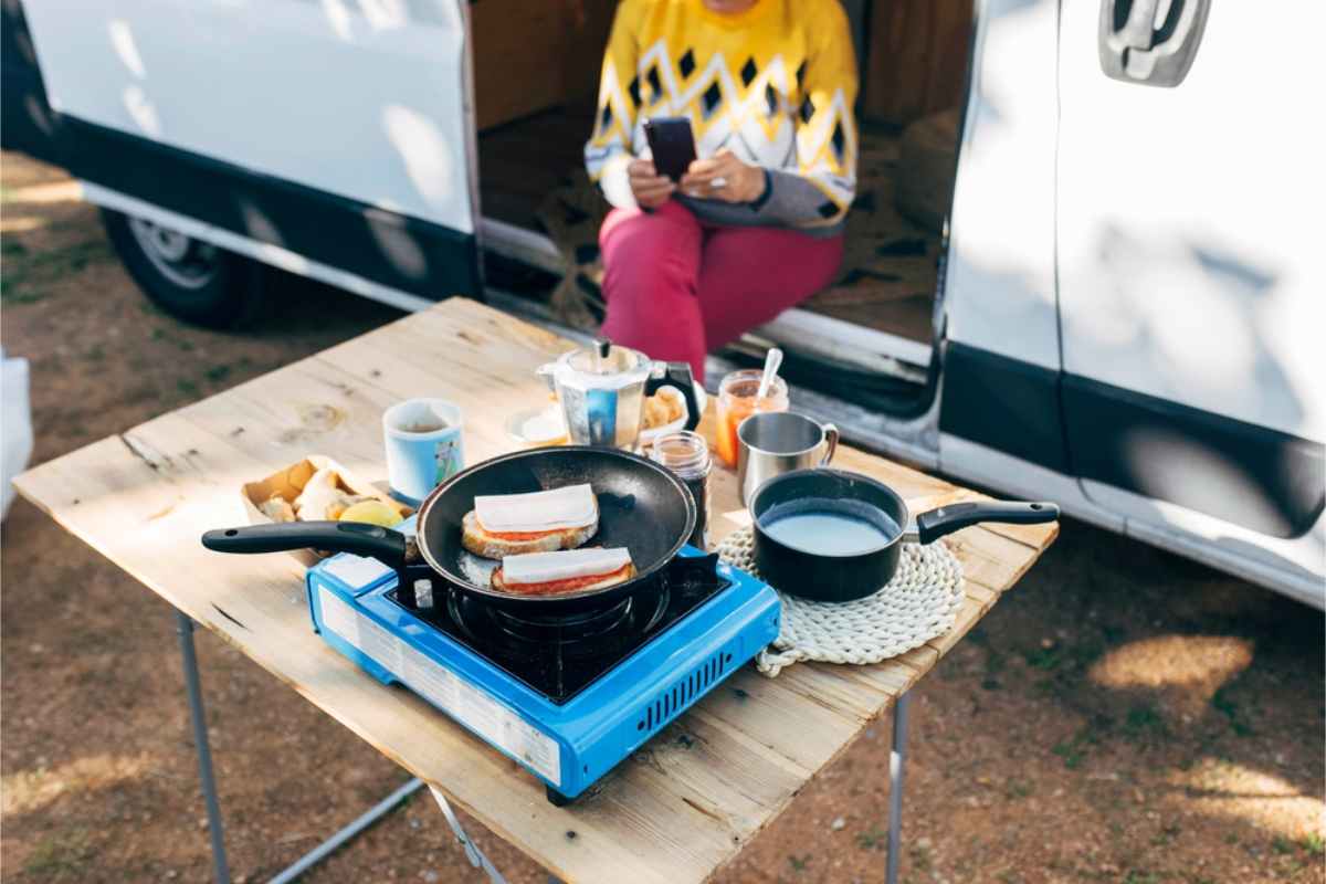 Camping kitchen set up in an outdoor table