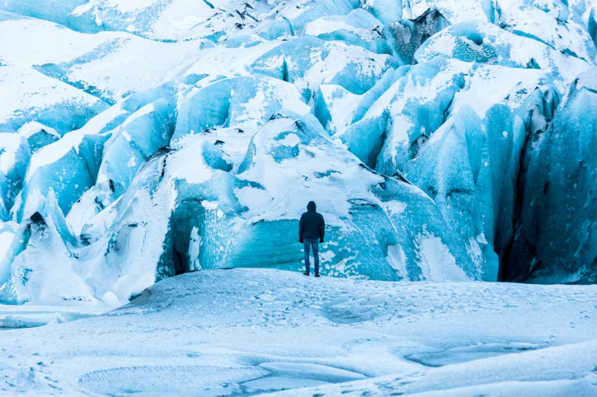 Tourist hiking a glacier in Iceland