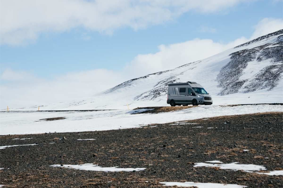 Campervan parked in a snow covered area