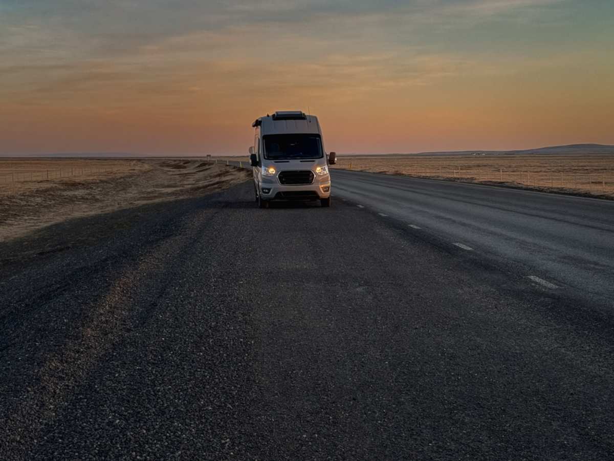 Compact motorhome on Iceland's ring road at dusk
