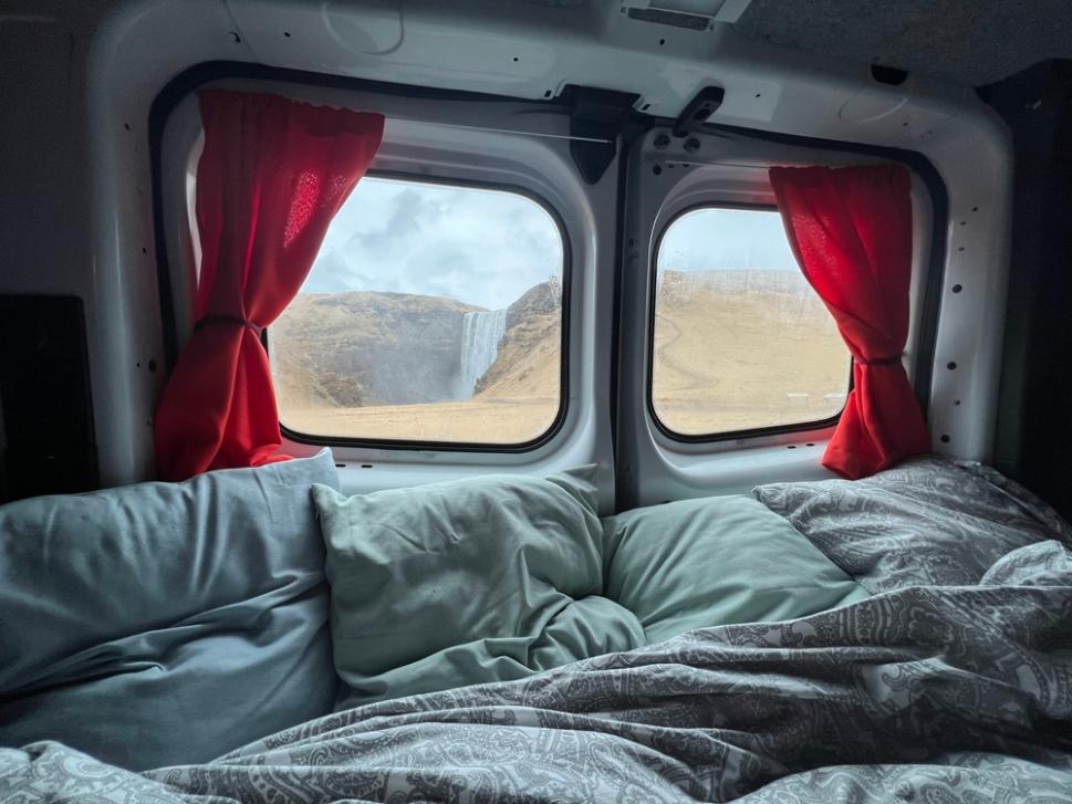 Interior of a capervan with views of Iceland's impressive landscape