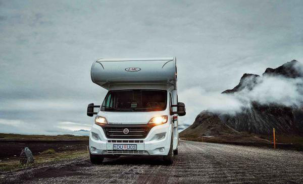 Cloudy landscape with rented motorhome in Iceland
